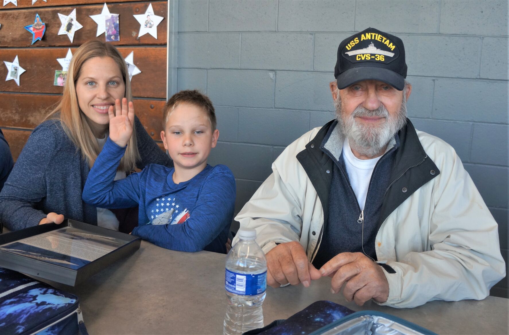 U.S. Navy veteran Ted Scholtz enjoys lunch with his family at Williams Bay Elementary School on Veterans Day